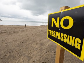 No trespassing signs went up on the beach at Port Dover in late April.  The majority of the beach is owned by private landowners including FW Knechtel Foods Ltd.  who issued a statement saying they are in talks with Norfolk County to work toward “a safe environment for our residents and guests to enjoy, and to protect the well-being of our family company.”  Brian Thompson/Brantford Expositor