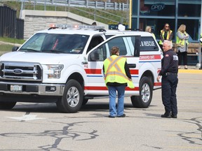 Chief Doug MacKenzie of the Point Edward fire service speaks with an official Friday at the Blue Water Bridge during an emergency response simulation Friday.  (Paul Morden/The Observer)