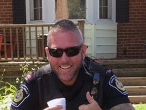 const.  Sean Van Vlymen is shown in this Facebook photo supporting a lemonade stand run by a couple of local children.  (Facebook)