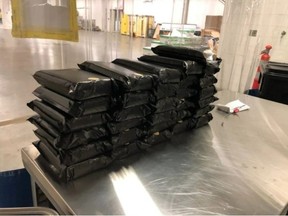 The Canada Border Services Agency provided this photo of stacked vacuum-sealed packages of suspected cocaine allegedly seized on March 31, 2021, at the Blue Water Bridge in Point Edward. (CBSA)