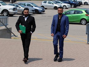 Harvinder Singh, right, and his lawyer, Gurpreet Dhaliwal, walk toward the Sarnia courthouse on Wednesday afternoon ahead of Singh's continuing trial. Singh, then a 25-year-old Brampton resident, was arrested on March 31, 2021, by border officers at the Blue Water Bridge and charged with importing a controlled substance and possession of a controlled drug for the purpose of trafficking.