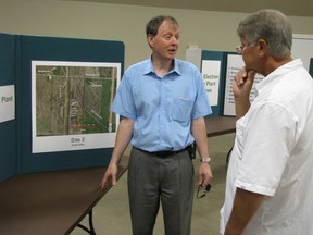In this 2012 file photo, Hubert Vogt, of Eastern Power, speaks with then St. Clair Township Mayor Steve Arnold at the Courtright Community Hall about the natural gas-powered electricity plant the company was building in the township.  (File photo/The Observer)