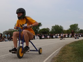 Lily Odolphy, a student at Sarnia's Northern Collegiate, peddles down the track during Friday's Vikes on Trikes fundraiser at the high school.
Paul Morden/The Observer