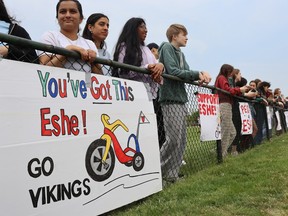Northern Collegiate students watch Friday's Vikes on Trikes fundraiser at the school track.  It was a fundraiser for the family of a 10-year-old local girl who is fighting leukemia.  Paul Morden/The Observer