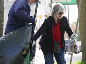 Steve Anema, Darlene Keats clear garbage for Petrolia's annual spring cleanup