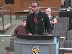 Okan Zeytinoglu, who owns the Harvey's at 321 Christina St. N. in Sarnia, addresses Sarnia city council May 15, 2023. (Screenshot)