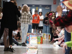 Sir John Moore students in Corunna take part in a cereal box domino event