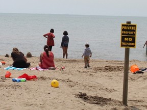 Most of the beach in Port Dover remained closed on the long weekend but the No Trespassing signs didn't stop some people from using areas that are off limits. MICHELLE RUBY/BRANTFORD EXPOSITOR