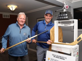 Tournament co-organizers Jeff Fenerty, left, and Bobby Chaumont show off a trophy for Golf SudburyÕs 81 Hole Grind at a press conference in Sudbury, Ont. on Thursday May 18, 2023. John Lappa/Sudbury Star/Postmedia Network