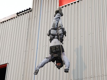 Const. Andrew Porringa, of the Greater Sudbury Police emergency response unit, demonstrates his skills during a tactical rope access demonstration at the Lionel E. Lalonde Centre in Azilda, Ont. on Thursday May 18, 2023. The event was part of Police Week activities. John Lappa/Sudbury Star/Postmedia Network