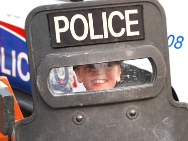 Isaac McMurray, 9, holds up a police shield at the Greater Sudbury Police emergency response unit and police K9 demonstrations at the Lionel E. Lalonde Centre in Azilda, Ont. on Thursday May 18, 2023. The event was part of Police Week activities. John Lappa/Sudbury Star/Postmedia Network