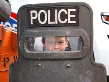 Joseph McMurray, 6, holds up a police shield at the Greater Sudbury Police emergency response unit and police K9 demonstrations at the Lionel E. Lalonde Centre in Azilda, Ont. on Thursday May 18, 2023. The event was part of Police Week activities. John Lappa/Sudbury Star/Postmedia Network