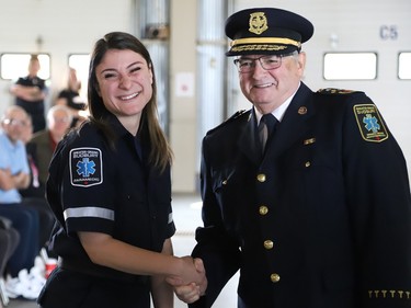 Kassandra Tancorre is welcomed into the paramedic service by Joseph Nicholls, Chief of Fire and Paramedic Services, at the launch of Paramedic Week at the Lionel E. Lalonde Centre in Azilda, Ont. on Tuesday May 23, 2023. A total of 14 new paramedic recruits were recognized for completing their orientation. John Lappa/Sudbury Star/Postmedia Network
