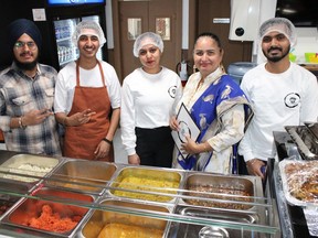 Timmins' new Punjabi Restaurant hosted its grand opening Monday morning. From left, Jaskaran Singh, employees Savraj Simar and Abhilasha Singh, owner Daisy Bains, and employee Akash Mishra. To support as many students as possible, Bains said she and her husband Bahadur decided to offer only part-time student jobs. She employs 22 at the vegetarian eatery that offers dine-in, takeout and a mobile food cart. Bahadur imports fresh sweets and some harder to find ingredients from Toronto twice a week. Punjabi Restaurant is located at 211 Algonquin Ave. and is open every day from 11 a.m. to 11 p.m.

NICOLE STOFFMAN/THE DAILY PRESS