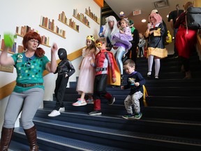 Superheroes, comic book characters and video game villans march down the steps at The Library as part of the programming for the 2023 Owen Sound Mini Con on Saturday, May 6, 2023. Greg Cowan/The Sun Times
