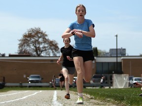 Grade 9 student Kiera Snelling wins a 800-metre race at the 2023 Owen Sound District Secondary School track and field day on Thursday, May 11, 2023.  Snelling competes for both the Saugeen Track and Field Club and the OSDSS track team. Greg Cowan/The Sun Times