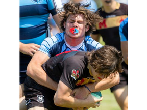 Lucas Vikings player Owen Jollymore tackles Nathan Van Hooydonk of the Medway Cowboys during the TVRA boys high school rugby gold-medal game on Tuesday May 30, 2023 in London. Mike Hensen/ The London Free Press