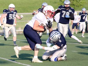 Brock Hoover (10) of the Sault Steelers is tackled by Jacob Bartolucci (6) of the Sudbury Spartans during Northern Football Conference action at James Jerome Sports Complex in Sudbury, Ontario on Saturday, June 3, 2023.