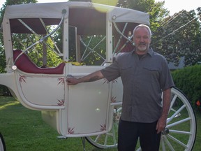 Rick Penhale with his father's carriage.