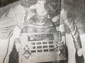 Lockerby Vikings captain Steve Watkinson gets a hero's welcome from a couple of cheerleaders in this press clipping after winning an OFSAA hockey title in 1968.