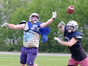 Sudbury Spartans players run through a drill during a practice at St. Benedict Catholic Secondary School in Sudbury, Ontario on Wednesday, June 7, 2023.