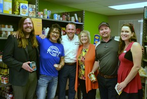 Representatives from Strickland's Stratford Toyota, Rosso Barber-O Shop and Stratford House of Blessing celebrate a recent fundraiser that brought in $750 for the Stratford food bank.  Pictured from left are Strickand's product advisor Josh Cameron, barbershop owner Rosso Villamil, Strickland's sales manager Josh Bes, House of Blessing executive director Eva Hayes, and Strickland's product advisors Colin Brisbois and Stefanie Walpole.  Galen Simmons/The Beacon Herald/Postmedia Network