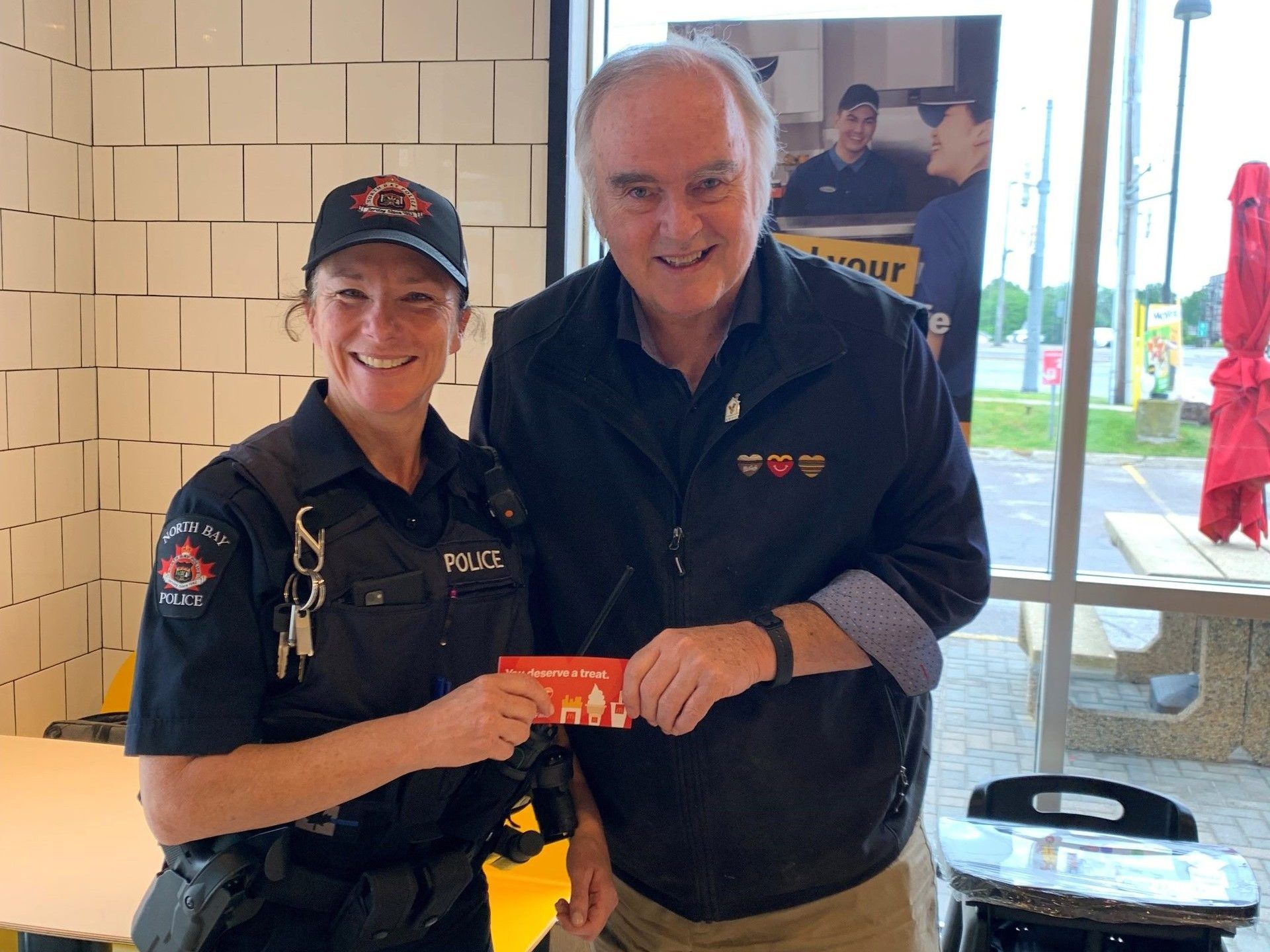 North Bay officers handing out coupons to encourage bicycle safety