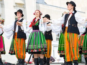 Polish dancers perform on the stage.