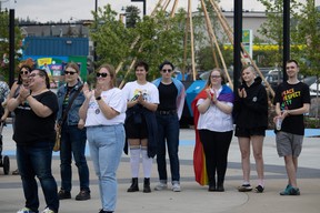 People applaud at a flag raising ceremony hosted by Pride YMM marking the start of Pride Month ceremonies at Kiyam Community Park in Fort McMurray on June 4, 2023. Vincent McDermott/Fort McMurray Today/Postmedia Network