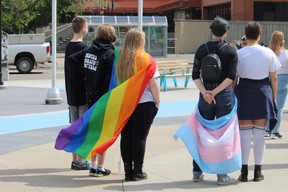 People with Pride and Transgender flags at a flag raising ceremony hosted by Pride YMM marking the start of Pride Month ceremonies at Kiyam Community Park in Fort McMurray on June 4, 2023. Vincent McDermott/Fort McMurray Today/Postmedia Network