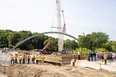 Reconstruction of the Victoria Bridge, spanning the Thames River along Ridout Street, continued on Tuesday June 20, 2023 as one of two steel arches was secured into place. (Derek Ruttan/The London Free Press)