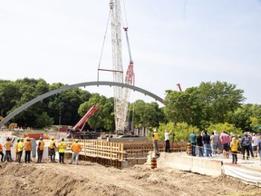 Reconstruction of the Victoria Bridge, spanning the Thames River along Ridout Street, continued on Tuesday June 20, 2023 as one of two steel arches was secured into place. (Derek Ruttan/The London Free Press)
