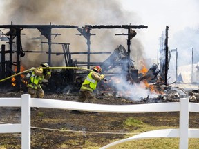 Firefighters battled a large barn blaze at a horse farm on Brigham Road near Delaware, southwest of London, on June 1, 2023. (Mike Hensen/The London Free Press)