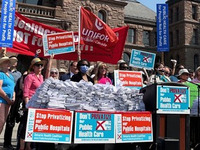 Ontario Health Coalition members at Queen's Park Wednesday, May 31, 2023 dropped off ballots from their referendum on new provincial government funding for private clinics to reduce medical wait times. (Ontario Health Coalition photo)