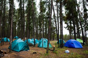 Tents outside Fort Chipewyan, Alta. for firefighters battling a wildfire outside the community on Thursday, June 15, 2023. Hundreds of firefighters from across Canada, the United States and Australia responded to a wildfire outside the community, which was evacuated on May 30, 2023. Vincent McDermott/Fort McMurray Today/Postmedia Network