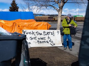 A sign at the Milennium Park encampment saying "Fuck the flats! I just want a home."