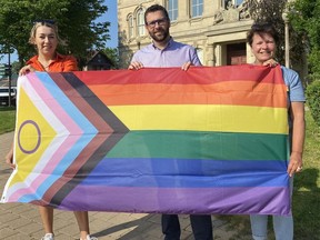 The Pride flag is flying at Norfolk County's administration building in downtown Simcoe during Pride Month in June. From left, Norfolk Mayor Amy Martin, along with county councillors Alan Duthie and Kim Huffman took part in a brief flag-raising ceremony at Governor Simcoe Square on May 31.