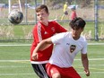 Michael Nazaruk, left, of St. Charles College, and Dyllan Trapper, of Chippewa Secondary School, battle for the ball during a NOSSA senior boys soccer game at James Jerome Sports Complex in Sudbury, Ont. on Friday June 2, 2023.