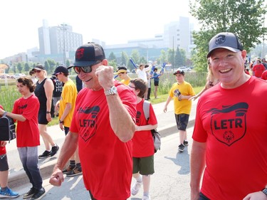 Greater Sudbury Police Chief Paul Pedersen, left, takes part in the annual Law Enforcement Torch Run (LETR) for Special Olympics in Sudbury, Ont. on Thursday June 22, 2023. Members of Special Olympics, the Greater Sudbury Police Service, the Ministry of the Solicitor General and students from Lasalle Secondary School and Lo-Ellen Park Secondary School participated in the event. The torch run raises funds across the province to help provide a year-round program of fitness, recreation, and competition for Special Olympic athletes. John Lappa/Sudbury Star/Postmedia Network