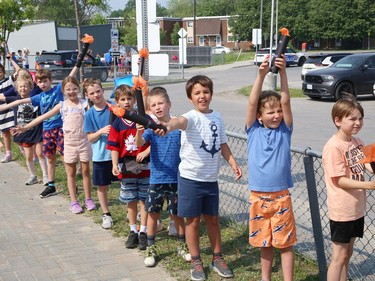 Participants in the annual Law Enforcement Torch Run (LETR) for Special Olympics are greeted by Ecole St-Denis students in Sudbury, Ont. on Thursday June 22, 2023. Members of Special Olympics, the Greater Sudbury Police Service, the Ministry of the Solicitor General and students from Lasalle Secondary School and Lo-Ellen Park Secondary School participated in the event. The torch run raises funds across the province to help provide a year-round program of fitness, recreation, and competition for Special Olympic athletes. John Lappa/Sudbury Star/Postmedia Network