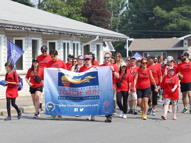Participants take part in the annual Law Enforcement Torch Run (LETR) in support of Special Olympics in Sudbury, Ont. on Thursday June 22, 2023. Members of Special Olympics, the Greater Sudbury Police Service, the Ministry of the Solicitor General and students from Lasalle Secondary School and Lo-Ellen Park Secondary School participated in the event. The torch run raises funds across the province to help provide a year-round program of fitness, recreation, and competition for Special Olympic athletes. John Lappa/Sudbury Star/Postmedia Network