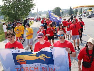 Participants take part in the annual Law Enforcement Torch Run (LETR) in support of Special Olympics in Sudbury, Ont. on Thursday June 22, 2023. Members of Special Olympics, the Greater Sudbury Police Service, the Ministry of the Solicitor General and students from Lasalle Secondary School and Lo-Ellen Park Secondary School participated in the event. The torch run raises funds across the province to help provide a year-round program of fitness, recreation, and competition for Special Olympic athletes. John Lappa/Sudbury Star/Postmedia Network