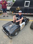 Austin Collins drives a miniature OPP vehicle