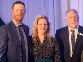 David and Jennifer VanDeVelde, on the left, owners of Wholesome Pickins Market and Bakery in Delhi, were presented the Delhi & District Chamber of Commerce's 2023 Business of the Year Award on May 17 by Jim Norman, on the right, outgoing Chamber president, and dignitaries.  CHRIS ABBOTT