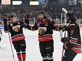 Colby Barlow celebrates a first-period goal with Sam Sedley and Deni Goure as the Owen Sound Attack host the Peterborough Petes inside the Harry Lumley Bayshore Community Centre for Hockey Day in Canada on Jan. 21, 2023. Colby Barlow hauled in some hardware this weekend at both the CHL and Owen Sound Attack awards. Sam Buschbeck/Owen Sound Attack