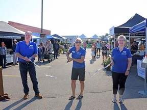 For the Whitecourt and District Chamber of Commerce (l-r), Past President Mark Dickin, President Louise Meier and Director Paula Miller cut the ribbon on the new Fresh Community Market on June 24. The market will run Saturdays.
