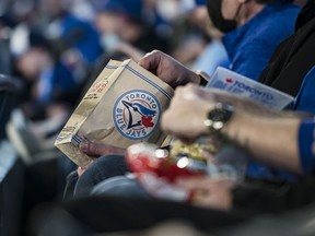 Fans enjoy food during a Blue Jays game at Rogers Centre.