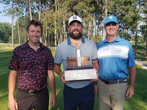 Idylwylde Men’s Invitational champion Joey Kremer is flanked by head pro David Bower and tournament chair Robbie Coe.