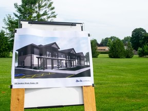 A display shows a rendering of the new building on the plot where it will be built.