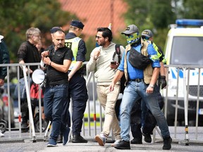 Salwan Momika escorted by police in Stockholm, Sweden